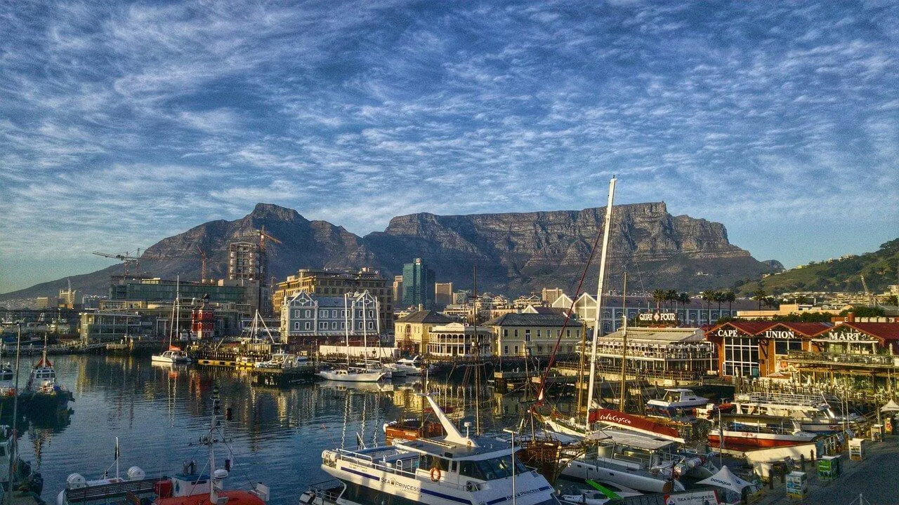 Table Mountain with town and boats in the foreground, cape town