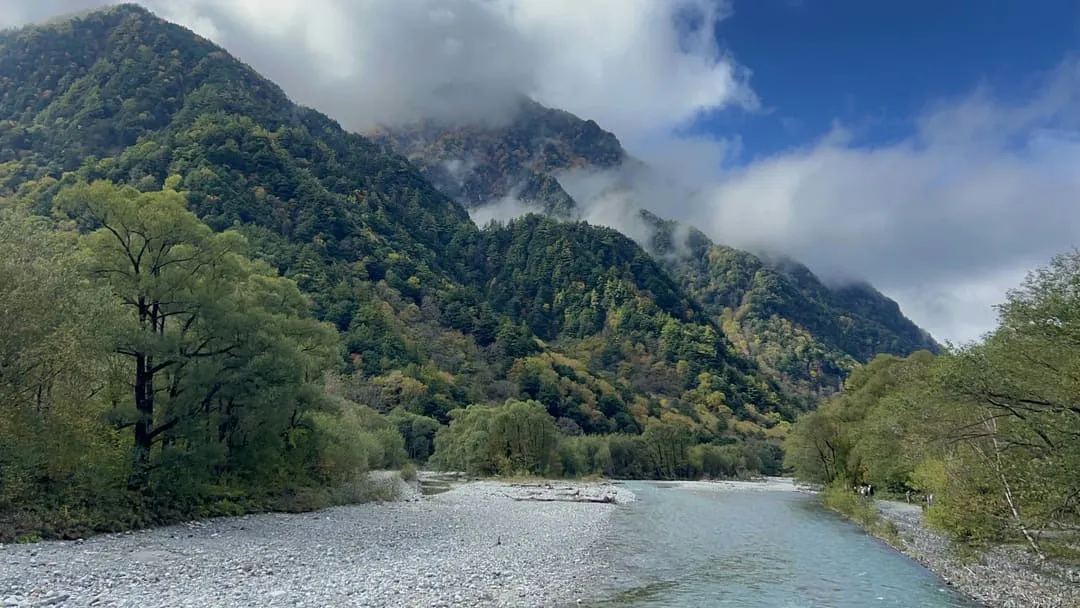 a river running through kamikochi national park, japan