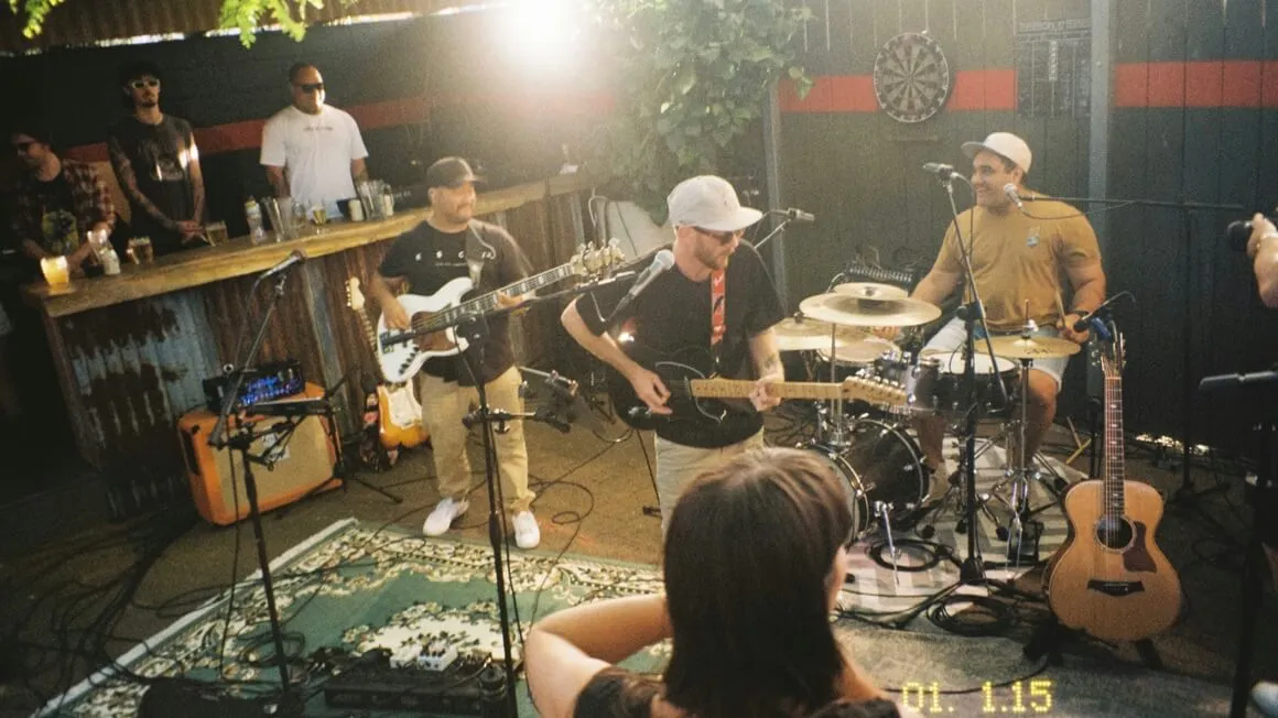 A band playing live music in a bar in Papamoa, Tauranga with a girl dancing, New Zealand