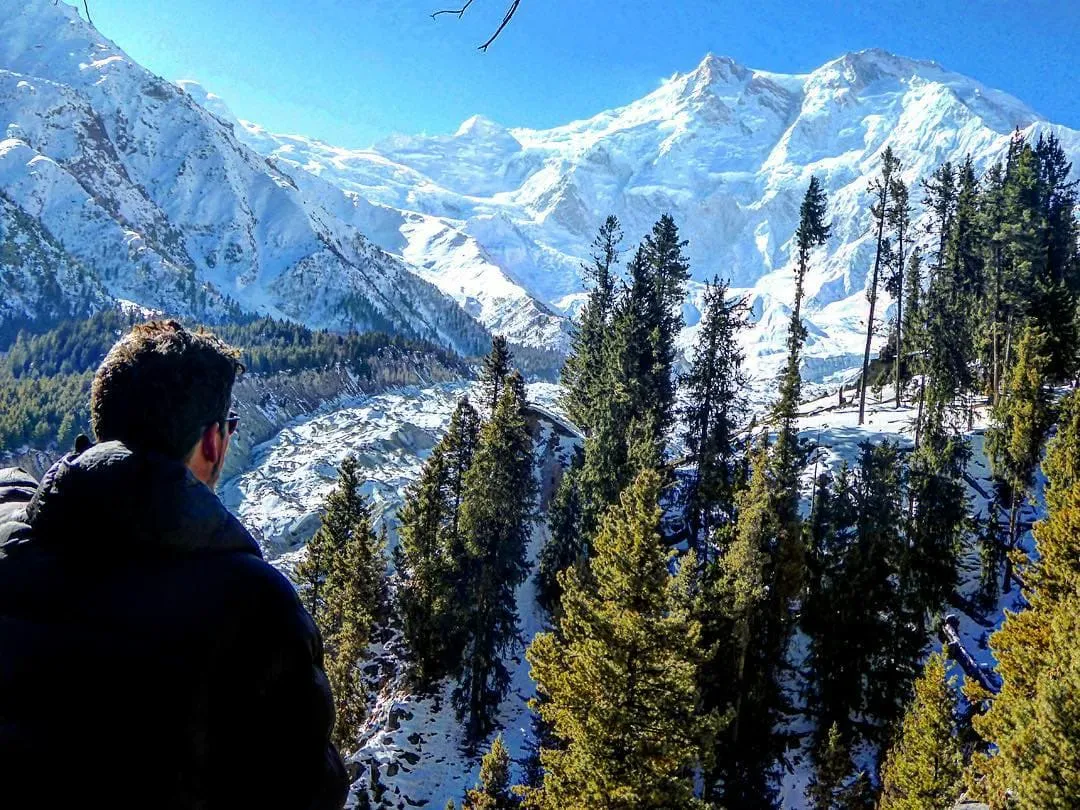 Will looking out over a snow covered mountainous landscape in Pakistan