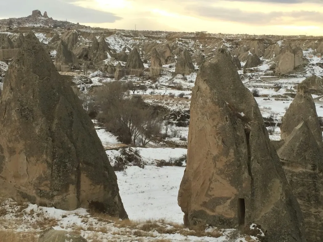 A snow covered valley in Cappadocia with the fairy chimney's filling the area