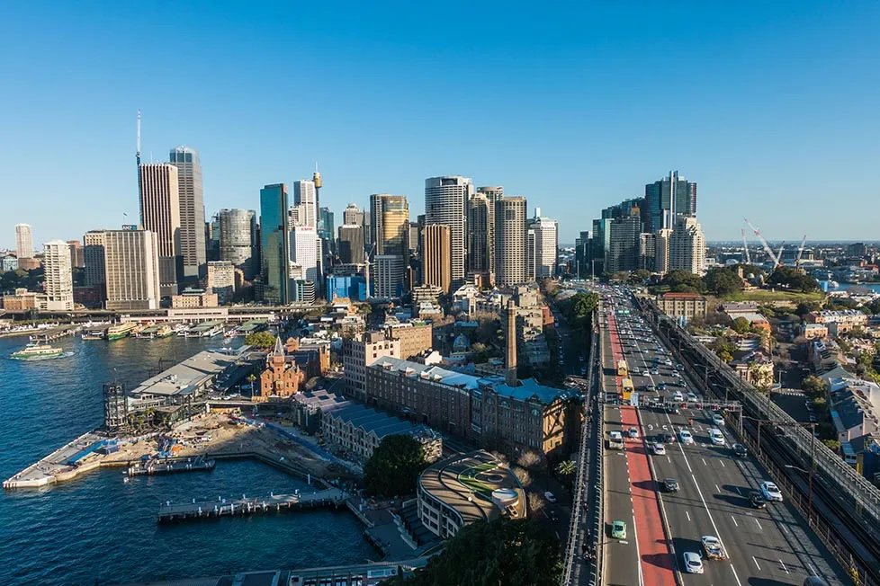 Looking back from the Sydney Harbour bridge over the city and bay.