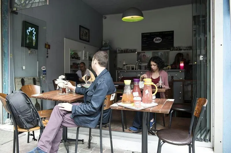 people eating free breakfast at the on site cafe at Cheers Downtown best hostels in Istanbul