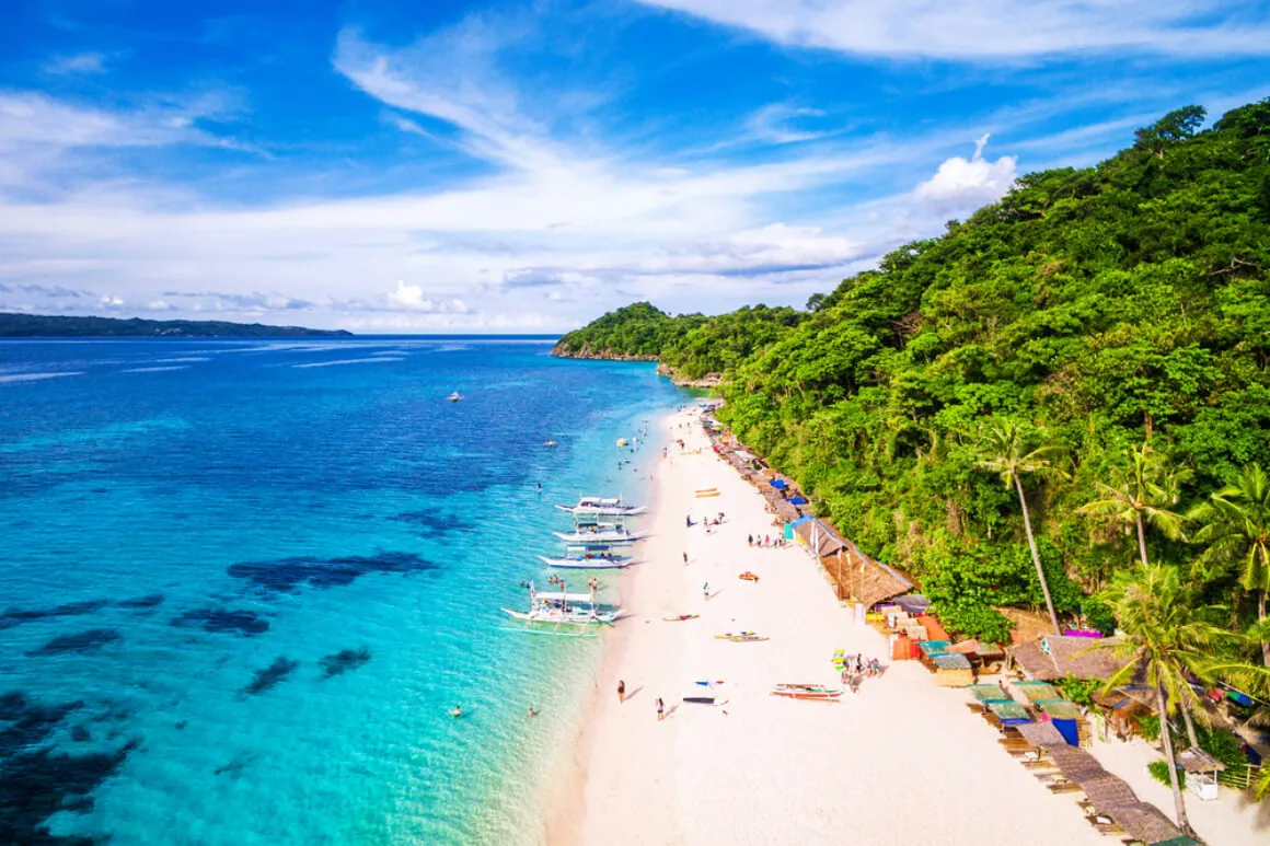 drone view of a white sand beach seen on Boracay in the Philippines