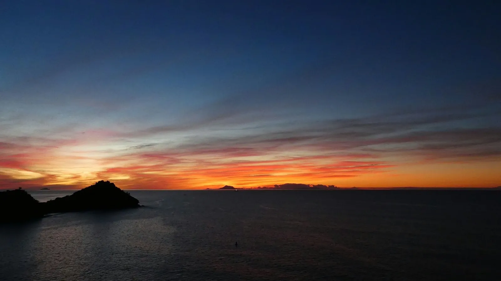 sunset streaking red over Saint John, Antigua